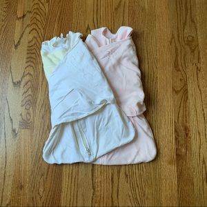 Two Newborn swaddlers sleep sacks. Pink cream yellow